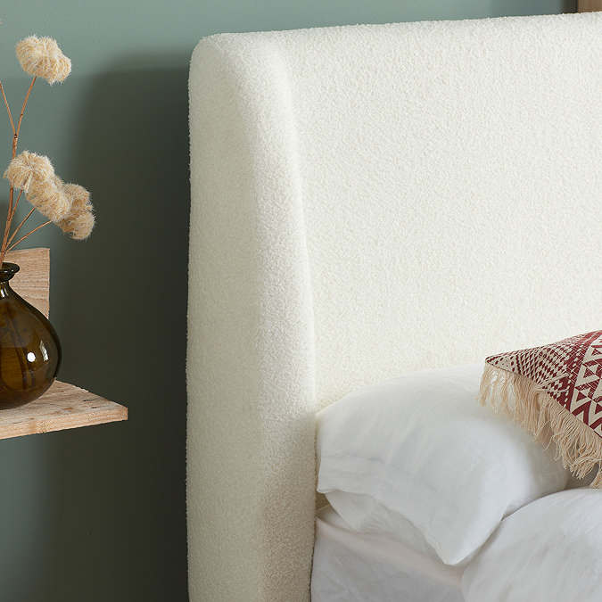 close up on boucle textured white headboard of evelyn double bed