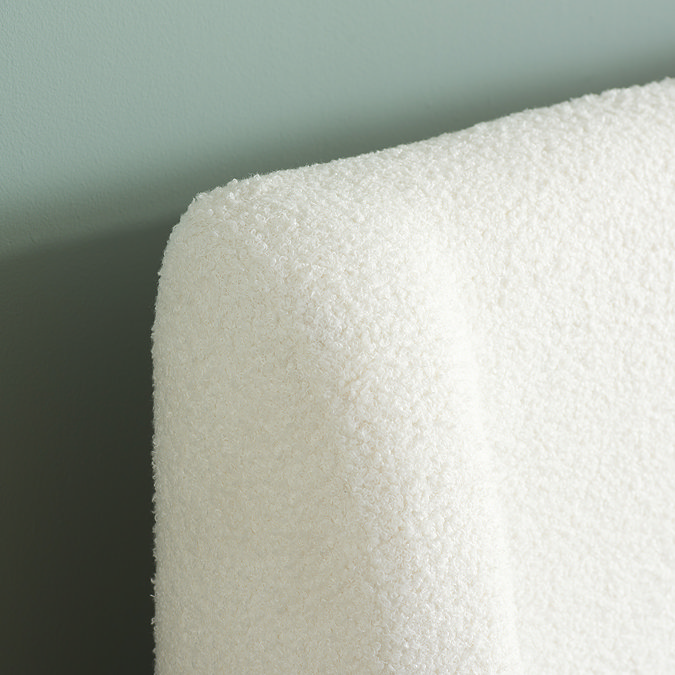 even closer image of white boucle headboard showing the soft texture