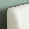 even closer image of white boucle headboard showing the soft texture