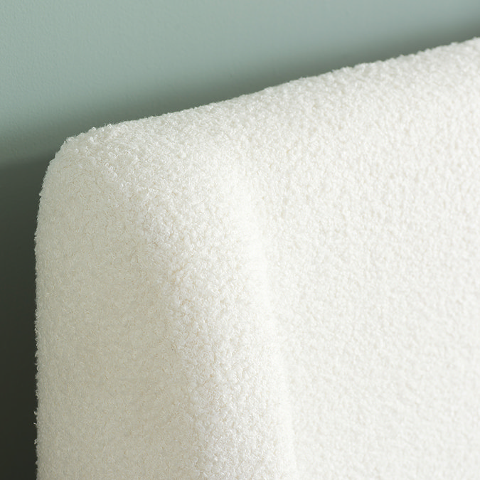 closer image of white boucle headboard, highlighting texture