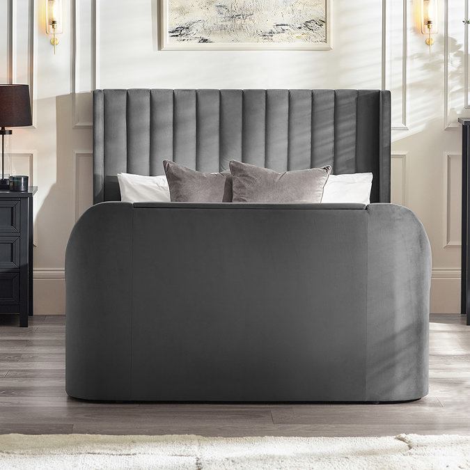 front on image of dark grey ottoman bed with rounded footboard and panelled headboard
