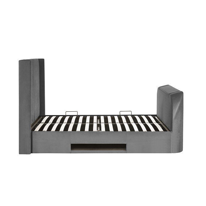 side on image cut out on white background of dark grey bed without mattress to show slatted base and metal side handles