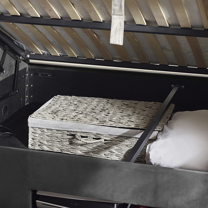 close up image inside ottoman compartment space of dark grey fabric bed