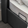 close up image of dark grey base of ottoman bed, with lift handles