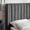 close up image of panelled fabric headboard of dark grey bed