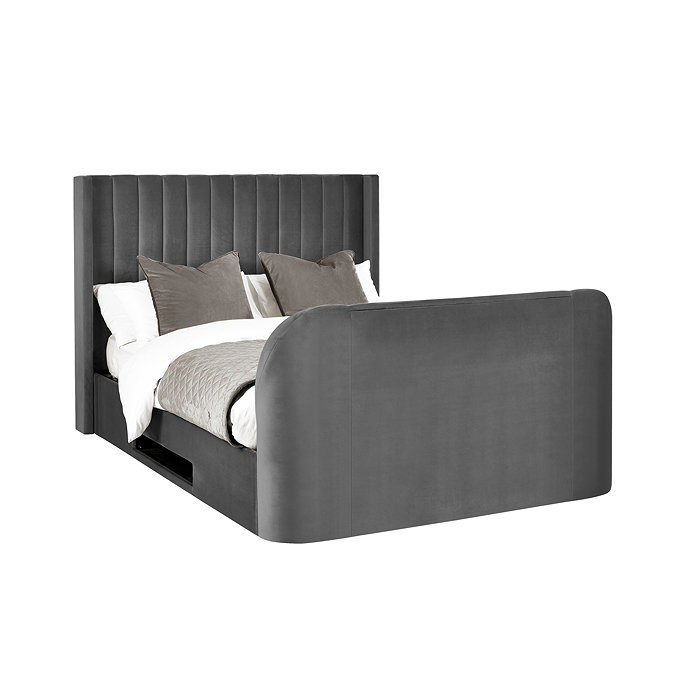 image cut out on white background of dark grey ottoman with rounded footboard