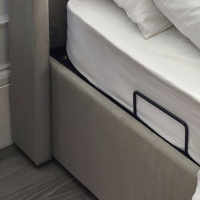 close up image on side lifts of ottoman storage bed