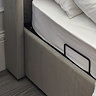 close up image on side lifts of ottoman storage bed