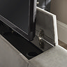 close up image of hatch of light grey bed footboard where tv is coming out of