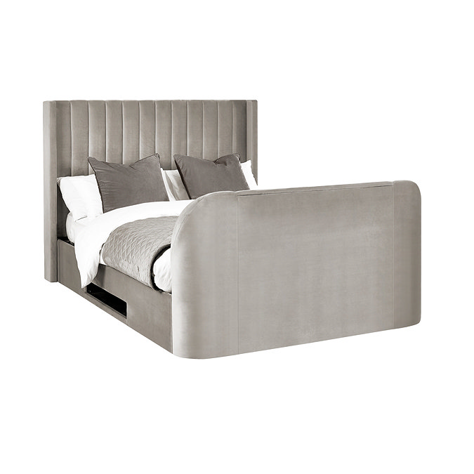 image cut out on white background of light grey fabric ottoman bed