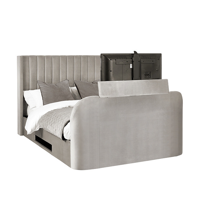 image cut out on white background of light grey ottoman bed with tv compartment in footboard