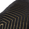 close up of gold geometric piped detailing on black cushion