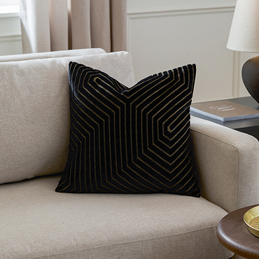 black square cushion with geometric detailing, cut out on white background