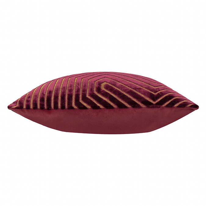side on image of burgundy cushion, cut out on white background.