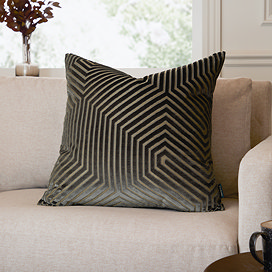 45x45cm charcoal grey cushion with geometric pattern, sat in corner of cream sofa