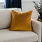 45x45cm gold cushion with geometric detailing, sat in corner of cream sofa