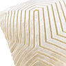close up image of ivory velvet cushion with gold geometric detailing.