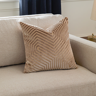 45x45cm mink brown cushion with geometric detailing, sat in corner of cream sofa