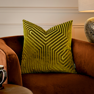 front image of square olive green cushion with geometric detailing, cut out on white background