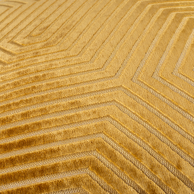 close up on gold cushion with gold stitch geometric pattern detail