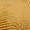 close up on gold cushion with gold stitch geometric pattern detail