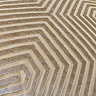 close up on light brown velvet cushion with geometric pattern
