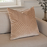 55x55cm mink brown cushion with geometric detailing, sat in corner of cream sofa