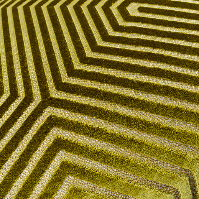close up on geometric pattern of olive green cushion