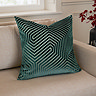 55x55cm teal green cushion with geometric detailing, sat in corner of cream sofa