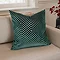 55x55cm teal green cushion with geometric detailing, sat in corner of cream sofa