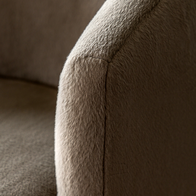 close up image of soft khaki fabric of accent chair