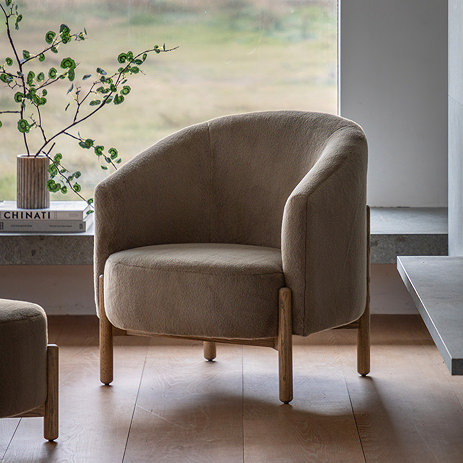 image of soft khaki rounded armchair with ash wood legs