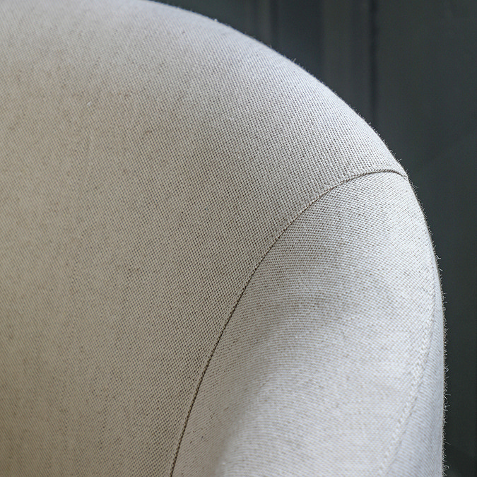close up on natural fabric of accent chair