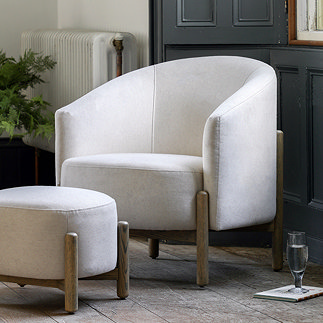 image of natural coloured fabric armchair with oak wood legs