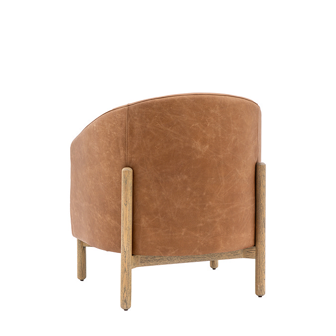 back image cut out of brown leather accent chair, rounded, with oak legs