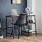 walnut coloured desk with black metal framework and modern grey chair pushed underneath