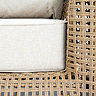 close up image of brown wicker construction of garden armchair with deep plush cushion