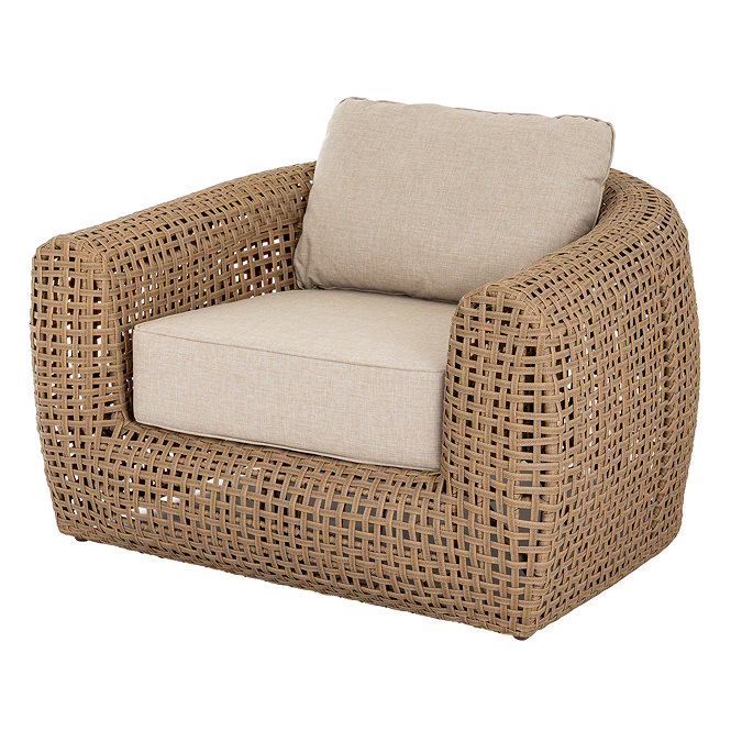 side on image cut out of chunky rattan garden armchair with cream cushions