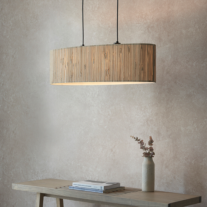 image of natural woven seagrass double pendant light against dining room wall
