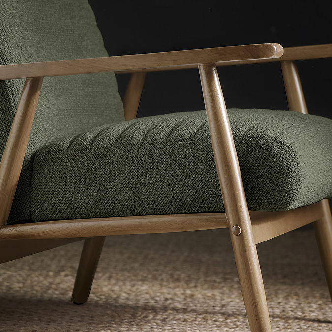 close up image of chenille olive green accent chair with warm wood arms 