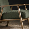 close up image of chenille olive green accent chair with warm wood arms 