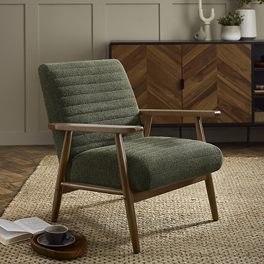 close up image of chenille olive green accent chair with warm wood arms 