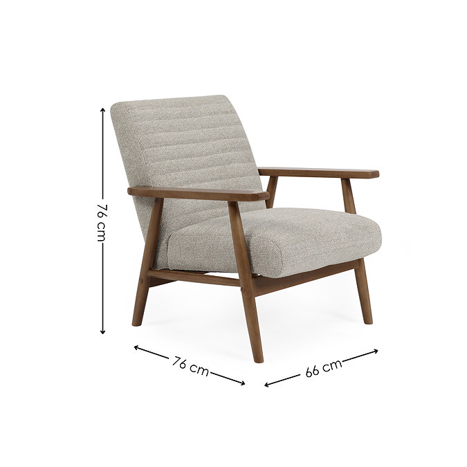 image cut out on white background of sand coloured upholstered chair with black arrow line dimensions