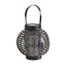 image cut out on white background of round black intricate lantern with handle