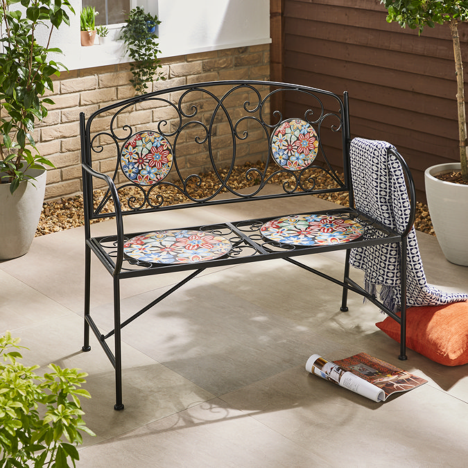image of wrought iron bench with circular mosaic seats