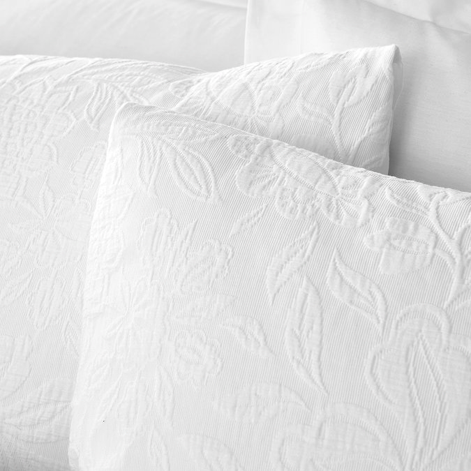 Fleur Matelasse Duvet Set close up on bed image 3