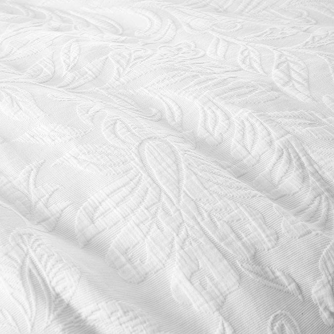 Fleur Matelasse Duvet Set close up on bed image 4