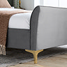 close up on bottom half of bed with grey velvet frame and thin gold legs