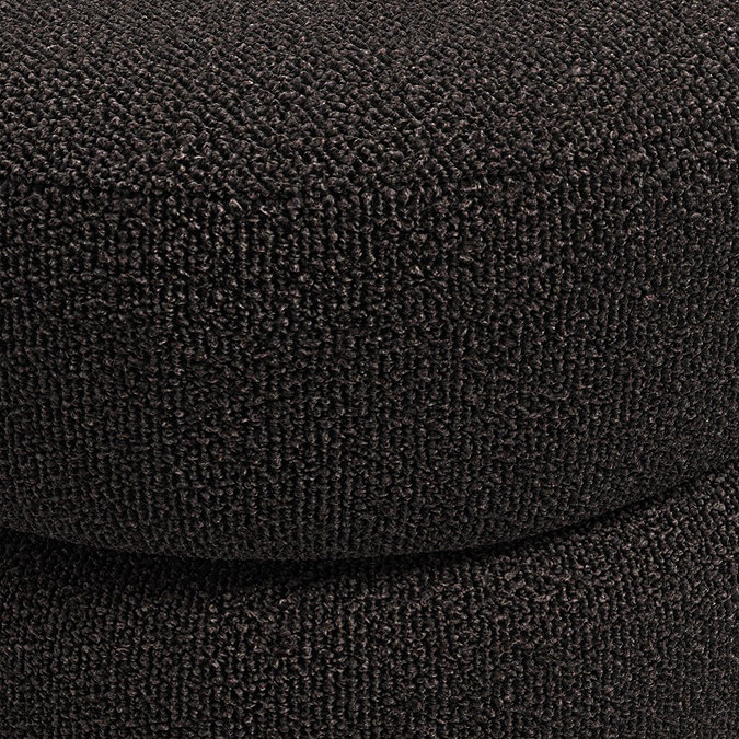 close up image of black boucle material of pouffe