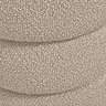 close up image of buff coloured boucle fabric of pouffe